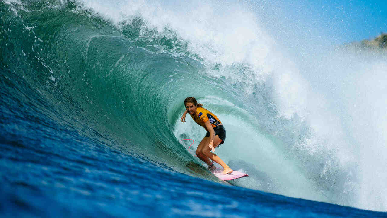 How did Stephanie Gilmore get into surfing?