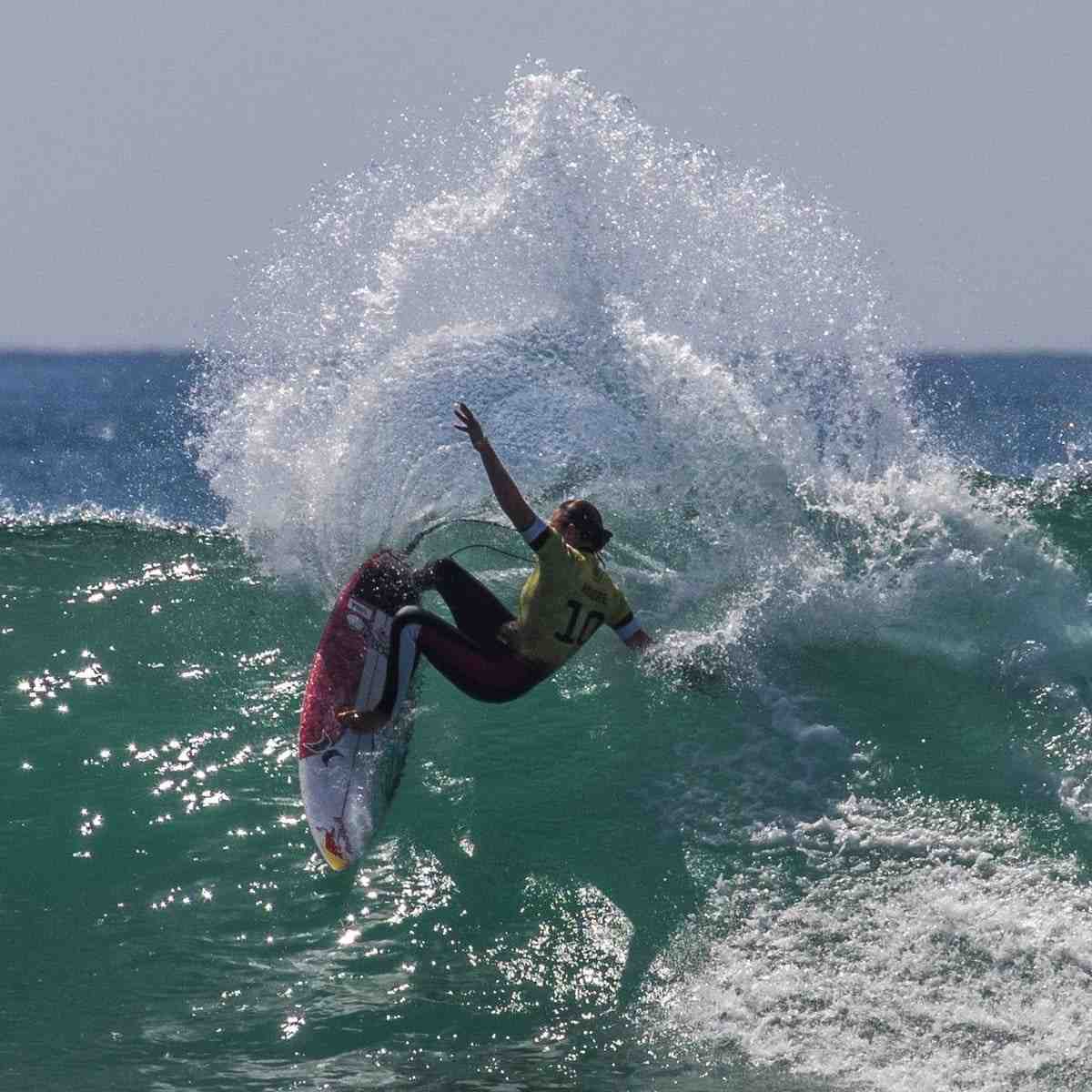 When did Mick Fanning start surfing?